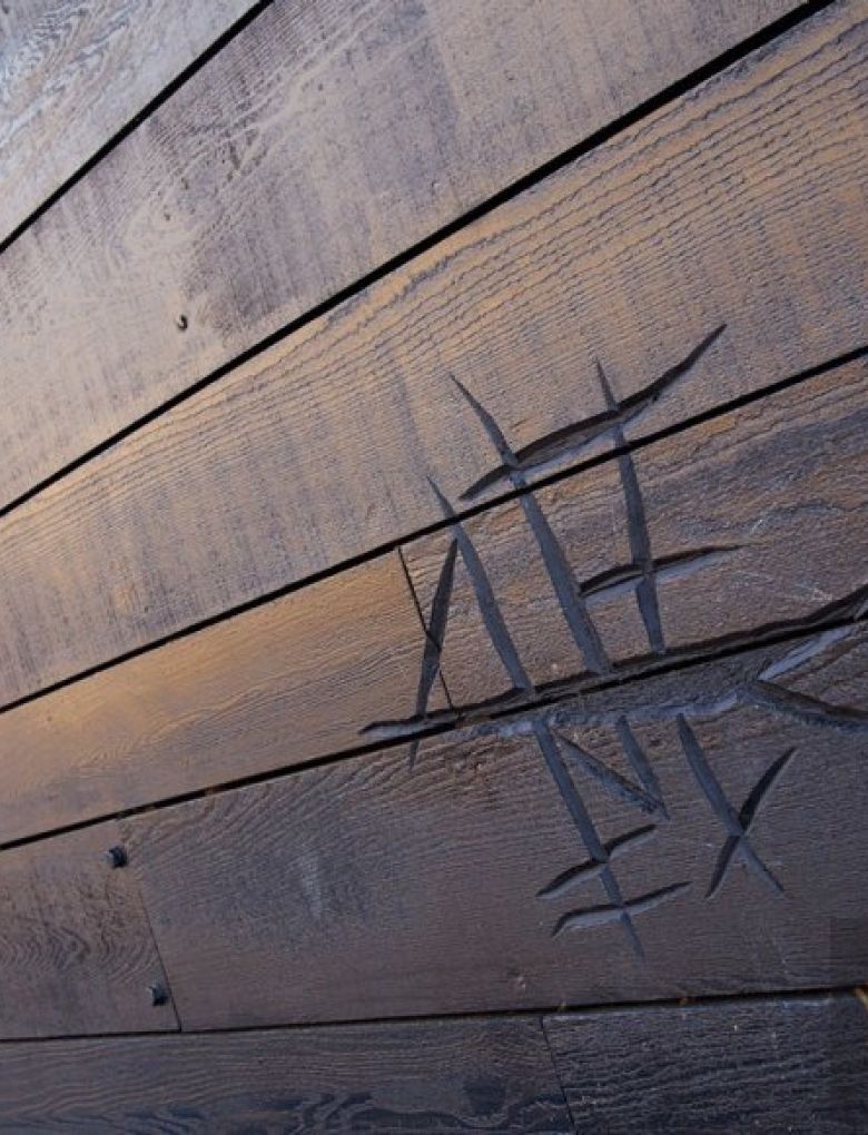 cipher carvings to BCL wood cladding panels at Mary Rose