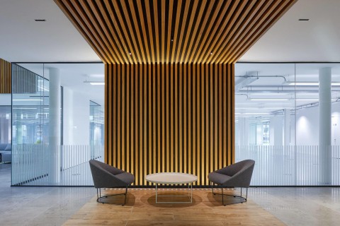 Seating area at the Charter Building with timber slat backdrop